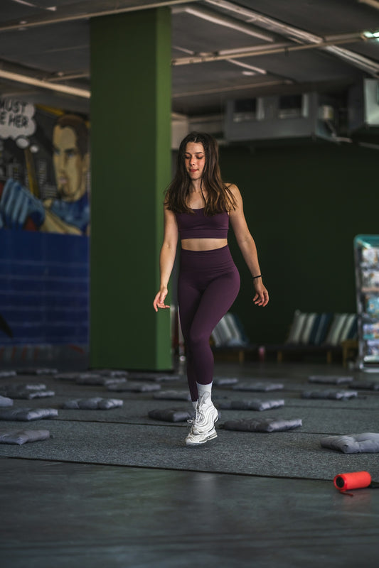 woman in black sports bra and black leggings