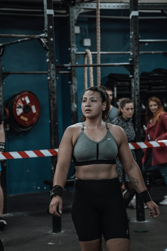 a woman standing in a crossfit gym