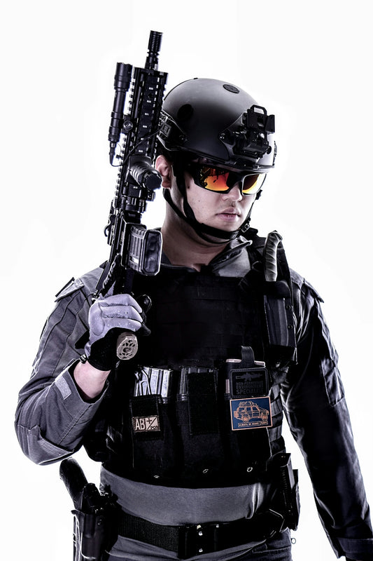 a man in a helmet holding a gun