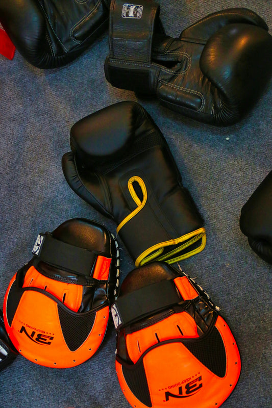 a pair of black and orange boxing gloves