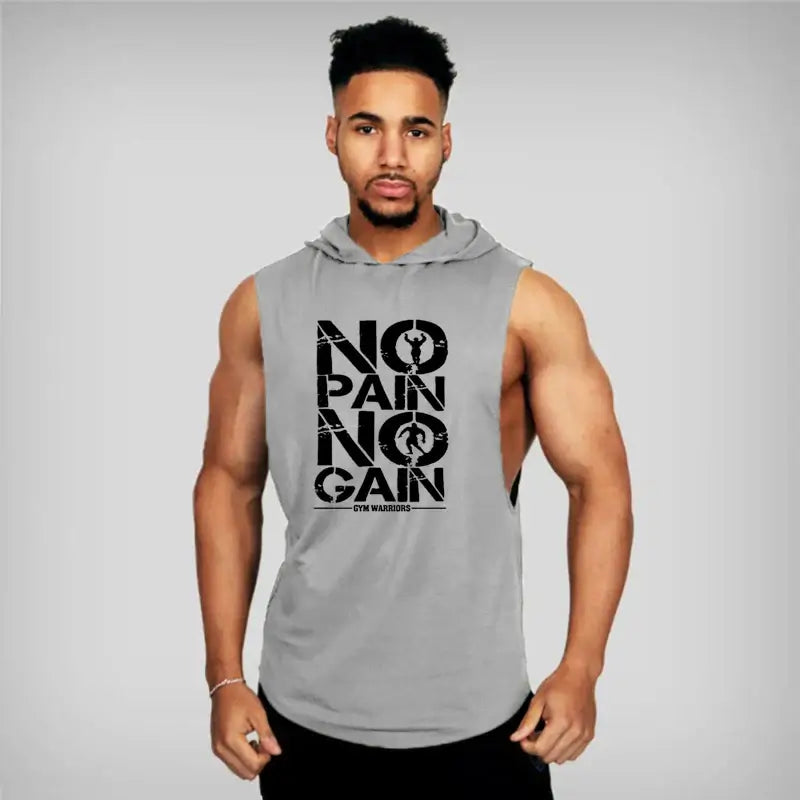 Muscular man wearing a sleeveless hooded gym shirt with 'NO PAIN NO GAIN' print, showcasing athletic style and workout motivation.