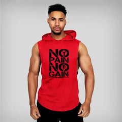Muscular man wearing a sleeveless hooded gym shirt with 'NO PAIN NO GAIN' print, showcasing athletic style and workout motivation.